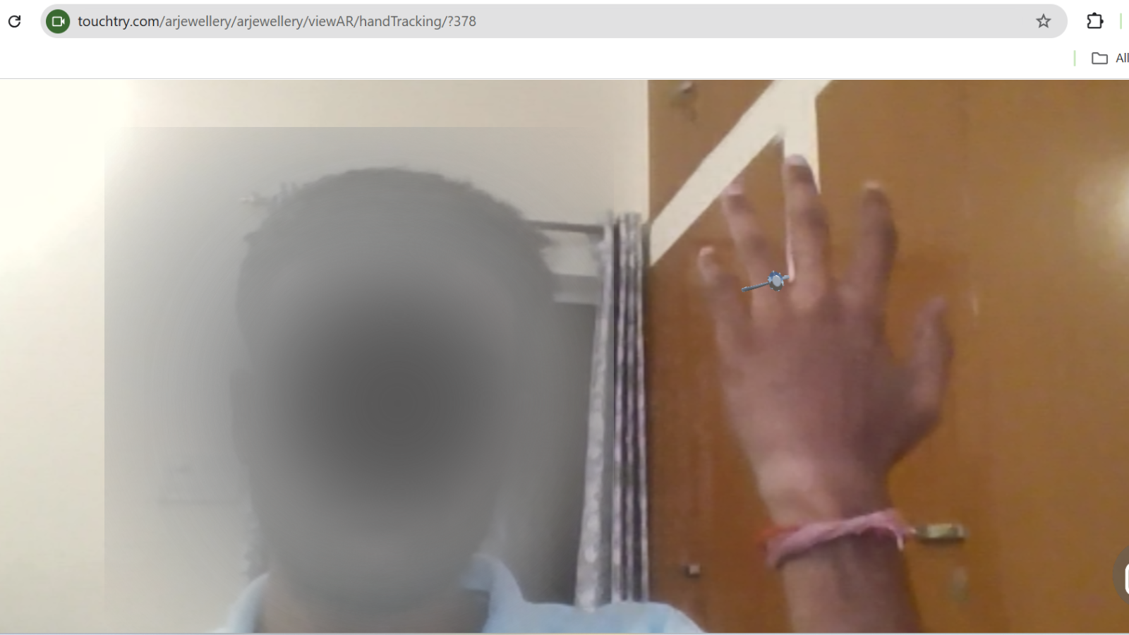 Shopper trying ring on hand in live mobile AR view